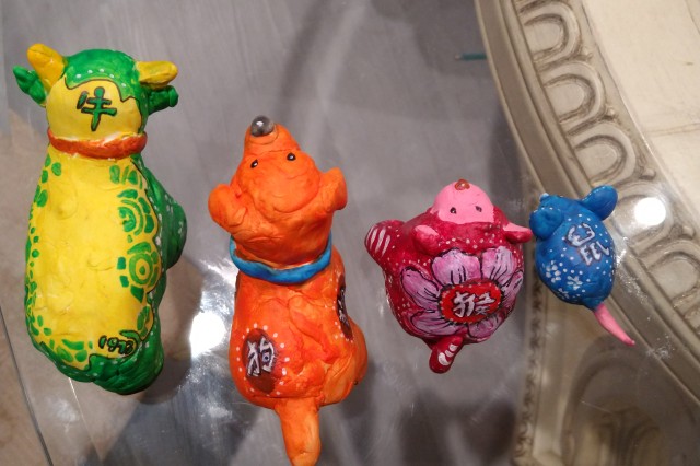 Decorated on the back of each animal is their Chinese character.