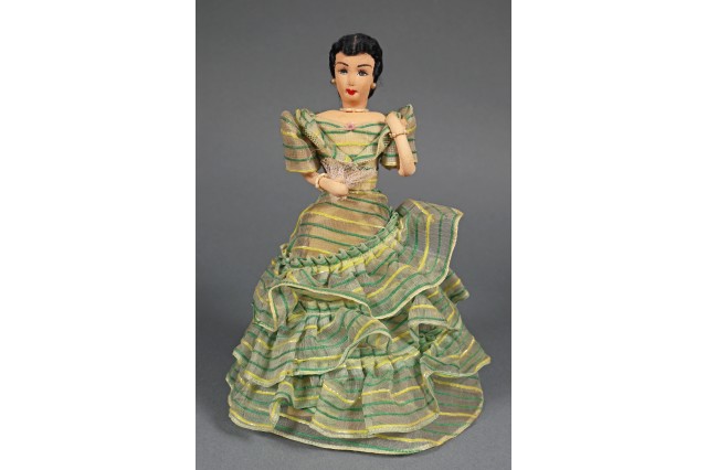 doll wearing dress 
