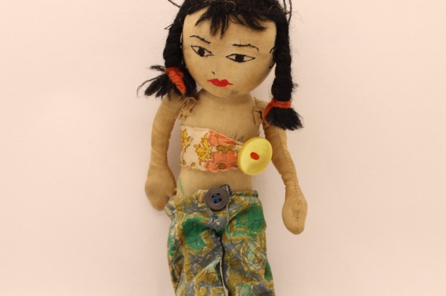 well loved and altered ragdoll with pigtails and a crop top 