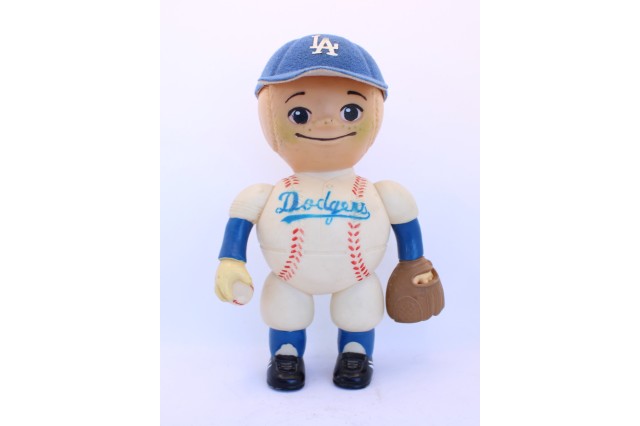plastic toy of boy made of baseballs 