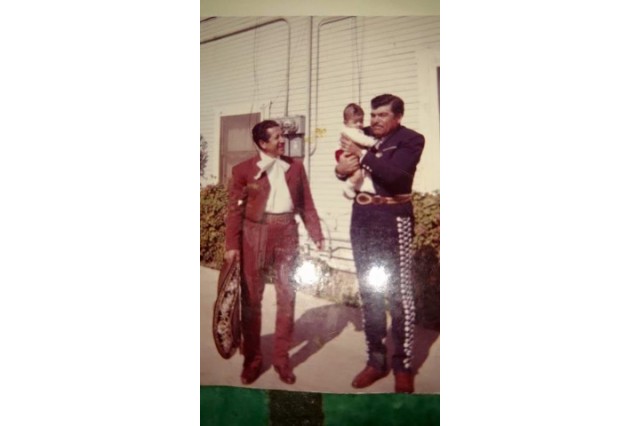 Martha Garcia and father in his mariachi suit