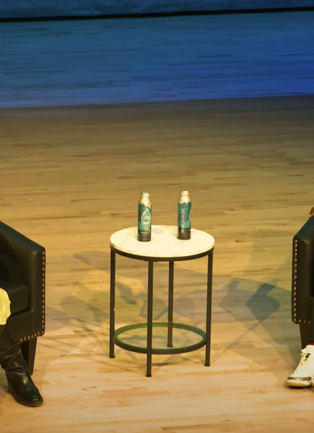Yewande Pearse and  AZA Allsop seated in chairs, facing each other on stage