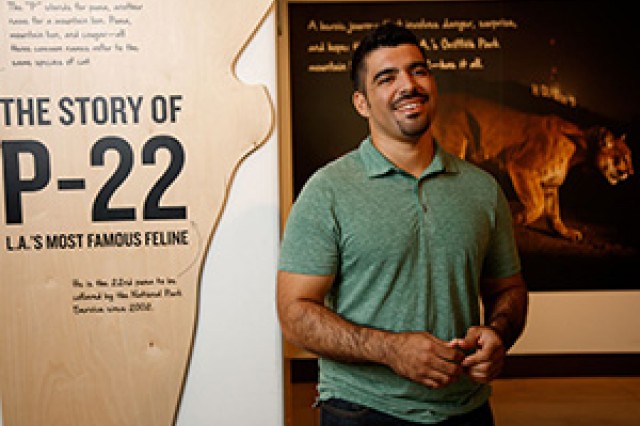 Miguel Ordeñana in front of P-22 exhibit at NHM