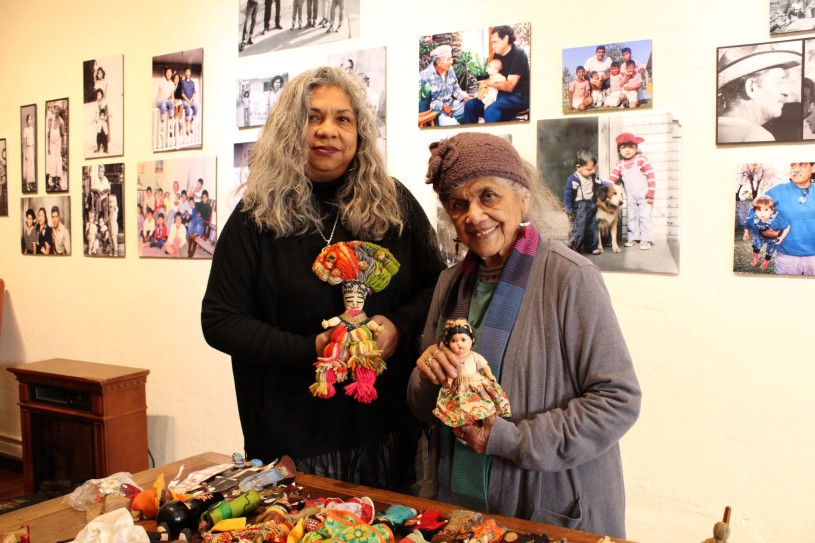 Rosanna and Ofelia Esparaza pose with two handmade dolls at their studio 