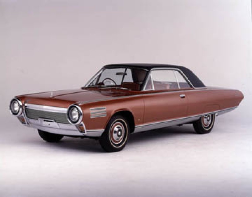 Brown 1963 Chrysler Turbine, two door sedan, with a black hard top.