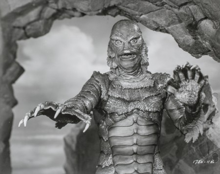 The fishy creature with arms outstretched, a still from the film The creature from the black lagoon. 